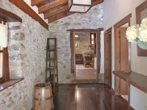 a hallway of a home with a stone wall at Holiday Home Uxaneko-errota by Interhome in Bera +11 photos