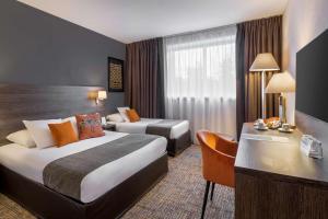 Voodi või voodid majutusasutuse Best Western Plus Hotel Admiral toas
