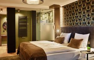 Postel nebo postele na pokoji v ubytování Hotel Erasmus - Mein Genuss- und Wellnesshotel