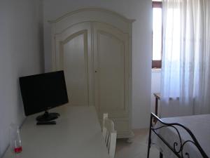 a white desk with a computer on top of it at Masseria Montecchie in Ceglie Messapica