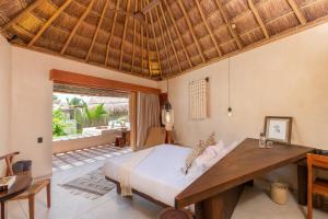Postel nebo postele na pokoji v ubytování Hotel Ma'xanab Tulum