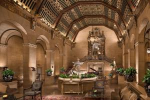 a large room with a large clock on the ceiling at Millennium Biltmore Los Angeles in Los Angeles