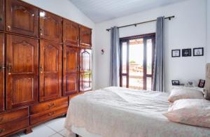 Кровать или кровати в номере Charme Caiçara