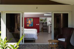 a hotel room with a bed and a table at Guácima Escondida Hotel Boutique in Guácima