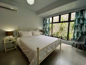 Katil atau katil-katil dalam bilik di Under The Tropics