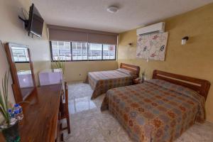 מיטה או מיטות בחדר ב-Hotel Plaza