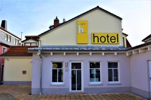 a hotel sign on the top of a building at Economy Hotel Kronach in Kronach