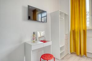 TV a/nebo společenská místnost v ubytování Level Rooms