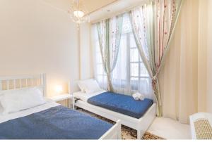 Artemis Villa near Athens airport tesisinde bir odada yatak veya yataklar