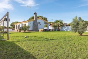 a house with a soccer goal in a yard at Casa Layda - Sólo Familias in Conil de la Frontera