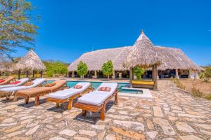 a resort with a swimming pool with chaise lounge chairs at Hotel Punta Teonoste Boutique Beachfront Resort in Popoyo +164 photos