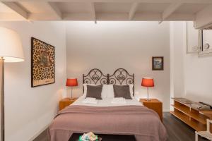 Ein Bett oder Betten in einem Zimmer der Unterkunft Saint Caterina House - Campo de' Fiori