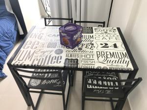 a black and white table with a vase on it at Microcentro Bebo home in Buenos Aires +13 photos