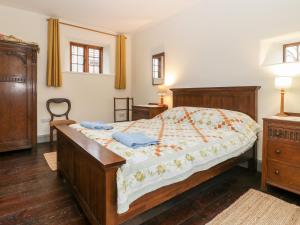 Llit o llits en una habitació de Old Cary Cottage