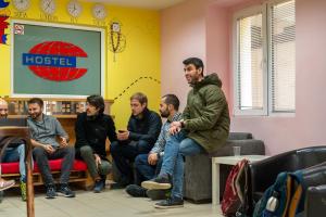 eine Gruppe von Menschen, die in einem Wartezimmer sitzen in der Unterkunft Smart Hostel Sofia in Sofia