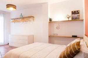 Katil atau katil-katil dalam bilik di Apartamento La Sabina