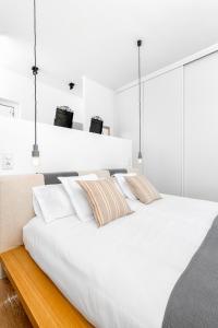 Posteľ alebo postele v izbe v ubytovaní iloftmalaga Premium Calle Granada