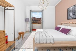 Posteľ alebo postele v izbe v ubytovaní iloftmalaga Premium Calle Granada
