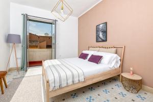 Posteľ alebo postele v izbe v ubytovaní iloftmalaga Premium Calle Granada
