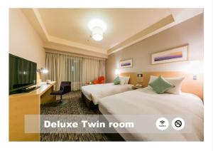 Ліжко або ліжка в номері Hotel Resol Trinity Sapporo