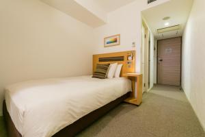 Ліжко або ліжка в номері Hotel Resol Trinity Sapporo