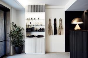 a room with a white closet with shoes at The Bower Byron Bay in Byron Bay