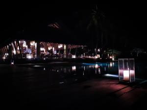 a night time view of a resort with a pool at Jeeva Klui Resort in Senggigi