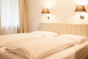 Postel nebo postele na pokoji v ubytování Hotel Villa Solln