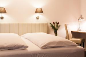 Postel nebo postele na pokoji v ubytování Hotel Villa Solln