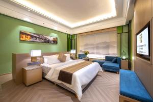 En eller flere senger på et rom på Metropolo Hotel-Guangzhou baiyunzhan jiangnan market canton fair phase free shuttle bus