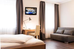 Postel nebo postele na pokoji v ubytování Hotel Villa Solln