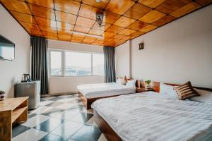 Postel nebo postele na pokoji v ubytování LE PHUONG Dalat
