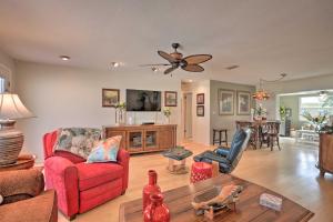 a living room with two chairs and a table at Single-Story Home Walk to Beach, Pier and River in Ormond Beach