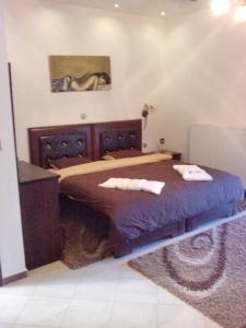 Un pat sau paturi într-o cameră la Guesthouse Lina