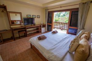 Voodi või voodid majutusasutuse Coral View Resort toas