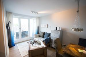 TV a/nebo společenská místnost v ubytování Das 54 Grad Nord - Apartments & More