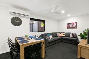 a living room with a couch and a table at MiHaven Shared Living - Martyn St in Cairns