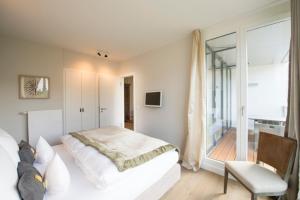 Postel nebo postele na pokoji v ubytování Das 54 Grad Nord - Apartments & More
