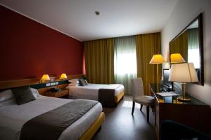 Postel nebo postele na pokoji v ubytování BV Hotel Oly