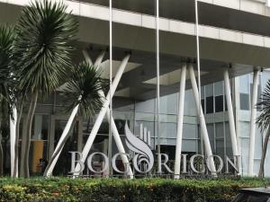 a building with a large sign in front of it at Channel Stay @ Bogor Icon Apartment in Bogor
