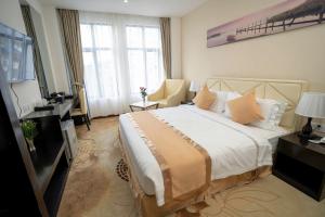 Giường trong phòng chung tại Hotel Sanchaung