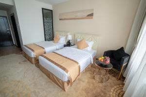 Giường trong phòng chung tại Hotel Sanchaung