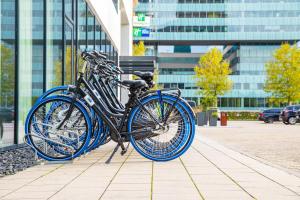 
a blue bike parked on a sidewalk next to a building at Holiday Inn Amsterdam - Arena Towers, an IHG Hotel in Amsterdam
