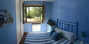 A bed or beds in a room at A PORTELA - Pereiro de Aguiar