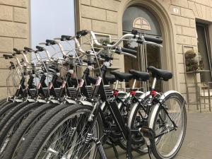 bicycles are parked in front of a building at Hotel Annunziata in Ferrara