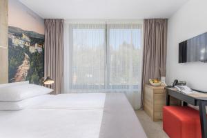 Postel nebo postele na pokoji v ubytování Boutique Hotel Esplanade