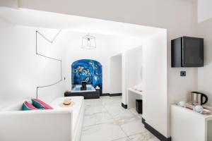 TV o dispositivi per l'intrattenimento presso Positano Art Hotel Pasitea