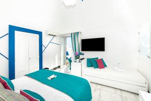 Letto o letti in una camera di Positano Art Hotel Pasitea