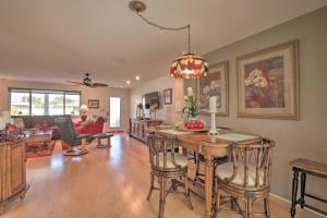 a living room with a dining table and a living room at Single-Story Home Walk to Beach, Pier and River in Ormond Beach