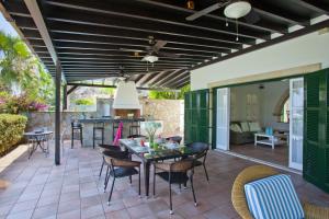 an outdoor patio with a table and chairs at Ayios Elias Pearl in Protaras